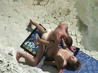 Naturist couple enjoy hot public beach fucking