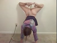 Gymnast girl fucks her sex toy while doing a handstand