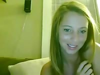 Beautiful brunette peels off her green bikini to reveal her amazing tits