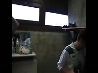 Men celebrate in a changing room