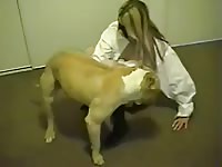 Beautiful and flirtatious girl doing secret bestiality at home